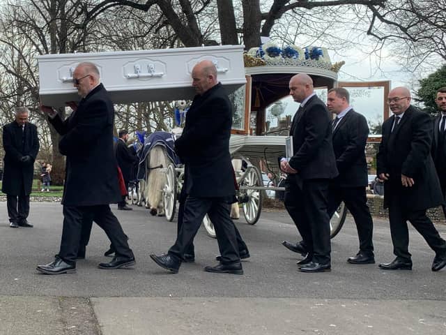 Ace Rewcastle's coffin is carried into St Mary's Church in Fratton today 
Picture: Sarah Standing