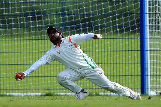 Pradeesh Nair takes a great catch to dismiss Simon Orr. Picture: Chris Moorhouse