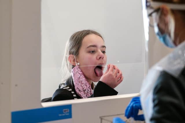 Lexi Miller, 11, self-administers her lateral flow test. Picture: Chris Moorhouse (080321-11)