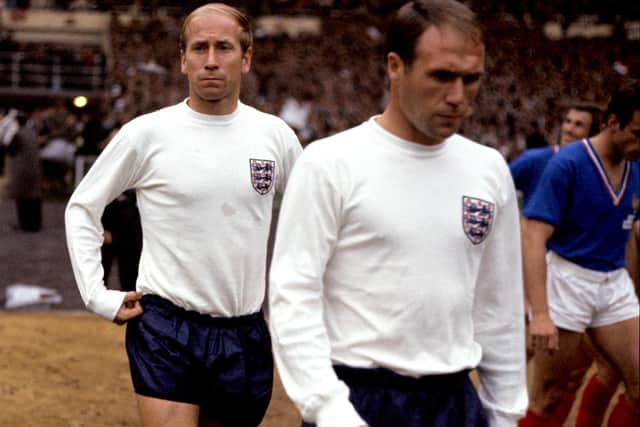 File photo dated 20-07-1966 of England's Ray Wilson (right) and Bobby Charlton walk out before the match. Sir Bobby Charlton has died aged 86, his family have announced. Picture: PA Photos/PA Wire.