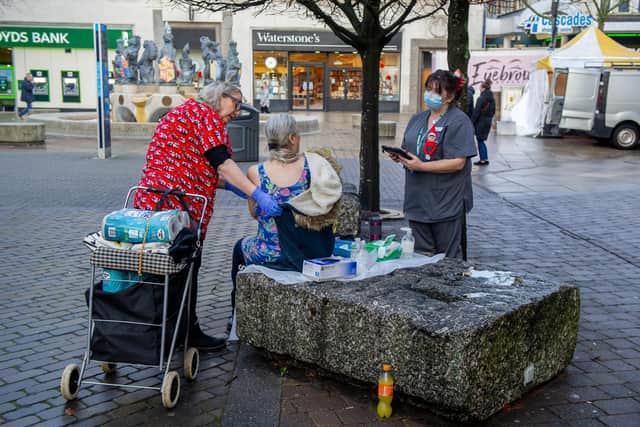 Booster jabs are being offered to homeless people at Commercial Road, Portsmouth on Friday 24th December 2021
Pictured: Clinical director of Brunel PCN, Carole Phillips and clinical pharmacy technician, Anthea Hayes giving booster jabs to a homeless person
Picture: Habibur Rahman