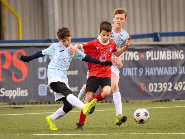Action from the Portsmouth Youth League Geldard Invitation Cup final between Jubilee 77 U13s and Castle United U13s (light blue and white kit). Picture: Keith Woodland (190321-384)