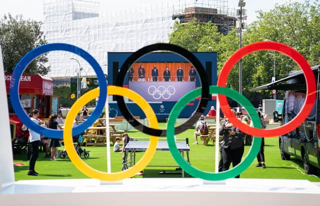 Fans watch the opening ceremony of the Tokyo 2020 Olympic Games on a big screen at the Team GB Tokyo 2020 Olympics fanzone, at Westfield, London Picture: Dominic Lipinski/PA Wire
