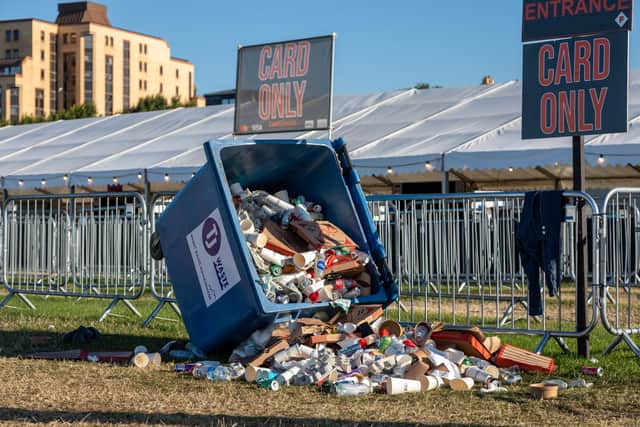 A litter bin on the common waiting to be cleared after the festival