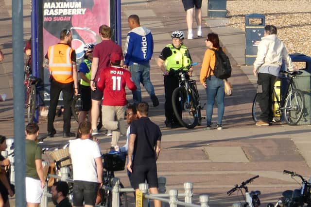 Police were seen attempting to move on large groups from the beach.