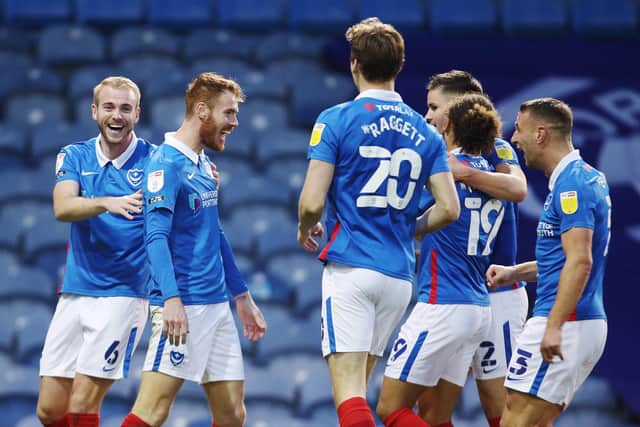Tom Naylor celebrates with his Pompey team-mates after his goal against Crewe.  Picture: Joe Pepler
