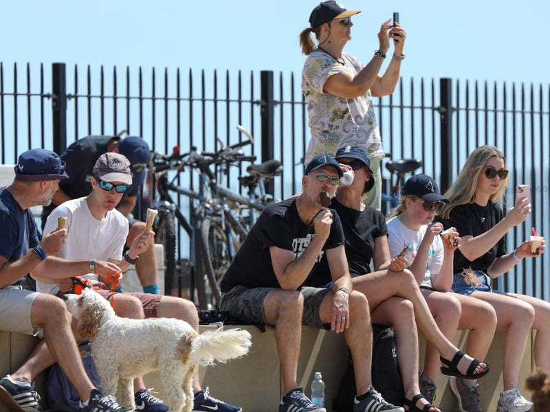 Ice cream was the order of the day as people waited for the yachts to return.Picture: Chris Moorhouse (270724-37)