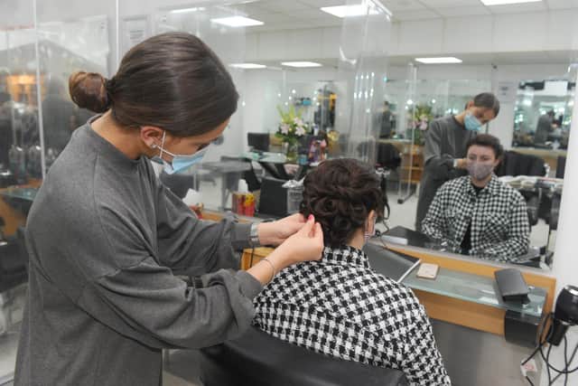Hair OTT apprentices training before opening on April 12.
Picture: Sarah Standing (050421-6120).
