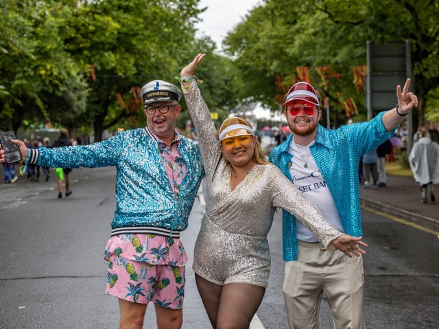 Mike Wheeler (58), Brigeth Encalada (24) and Ben Wheeler (25) from Oxford bringing some glitter to the gathering. Picture: Mike Cooter (240824)