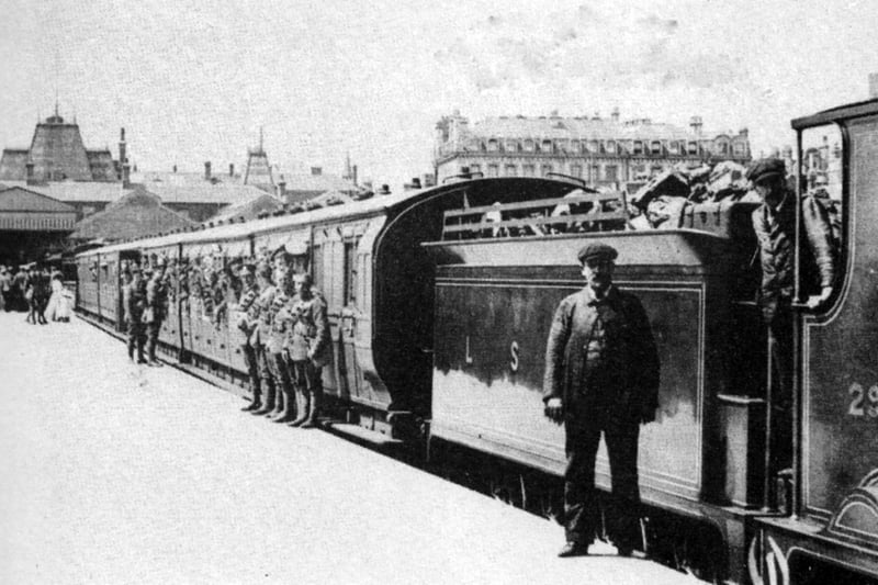 A troop train at Portsmouth Town station taking Hampshire Regiment soldiers to camp.
Taken at Portsmouth Town low level station we see a troop train preparing to leave for summer camp with soldiers from the Hampshire Regiment.