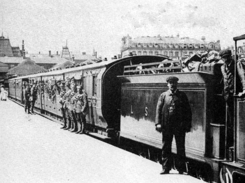 A troop train at Portsmouth Town station taking Hampshire Regiment soldiers to camp.
Taken at Portsmouth Town low level station we see a troop train preparing to leave for summer camp with soldiers from the Hampshire Regiment.