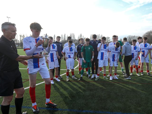 The referee presents captain Callum Mann with the cup. Picture: Chris Moorhouse