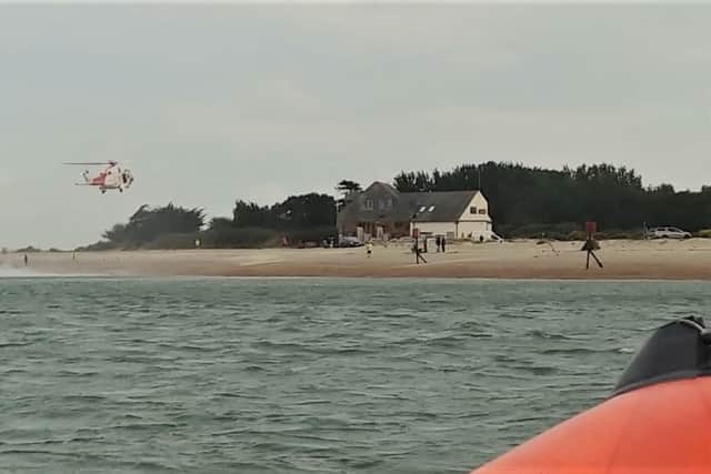 The fishermen were airlifted to safety. Picture: Hayling Island Lifeboat Station