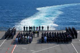 HMS Albion's sailors and marines on the flightdeck, attending the 40th anniversary remembrance service for Foxtrot 4, June 9, 2022