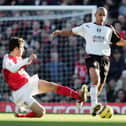 Arsenal's Cesc Fabregas challenges Zesh Rehman, then of Fulham, during a Premier League game in December 2004. Picture: Phil Cole/Getty Images.