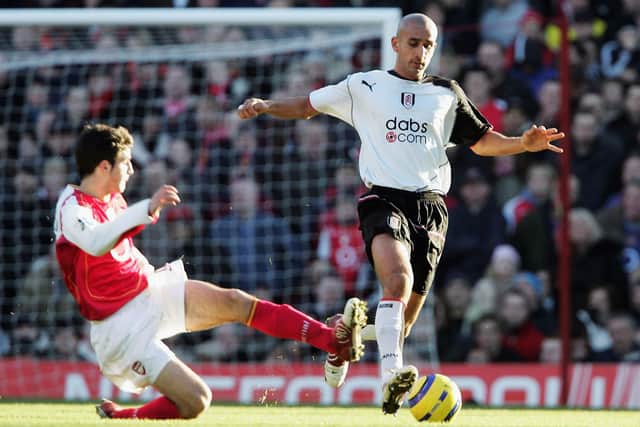 Arsenal's Cesc Fabregas challenges Zesh Rehman, then of Fulham, during a Premier League game in December 2004. Picture: Phil Cole/Getty Images.
