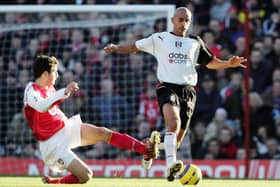 Arsenal's Cesc Fabregas challenges Zesh Rehman, then of Fulham, during a Premier League game in December 2004. Picture: Phil Cole/Getty Images.