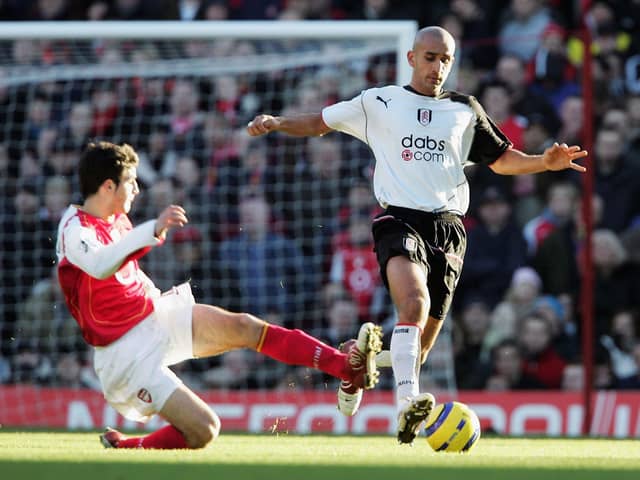 Arsenal's Cesc Fabregas challenges Zesh Rehman, then of Fulham, during a Premier League game in December 2004. Picture: Phil Cole/Getty Images.