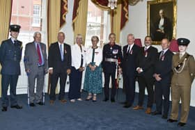 Malcolm Dent, third left, and Andrew Wing, second right, at their BEM presentation ceremony. Picture by Tony Knight.