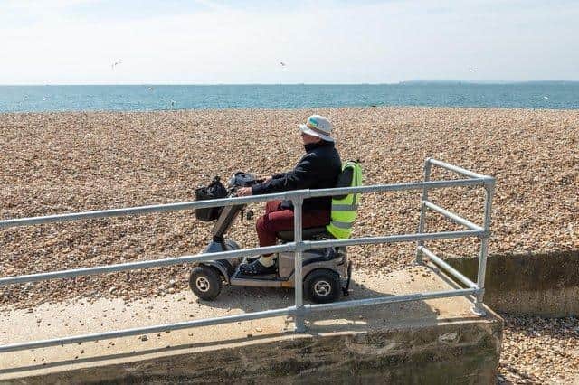 Rod Hall (80) at the accessibility ramp on Hayling Island beach, where a sea view is blocked by sea defences. Picture: Mike Cooter (300422)