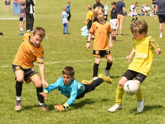 Action from the Clanfield youth football tournament at Horndean Technology College. Picture: Keith Woodland (270521-818)