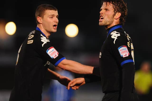 Carl Dickinson with Pompey team-mate Herman Hreidarsson against Brighton in January 2011. The on-loan Stoke defender had two Fratton Park loan spells. Picture: Mike Hewitt/Getty Images