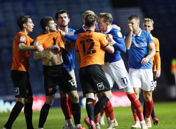 Ronan Curtis and Oxford's John Mousinho were at the centre of an argument after the final whistle of last night's 1-1 draw. Picture: Joe Pepler