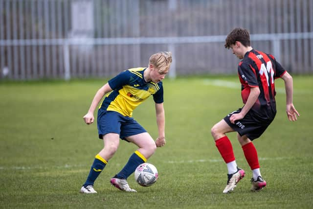 Moneyfields under-18 player Josh Hughes takes on his man last weekend. Picture: Alex Shute