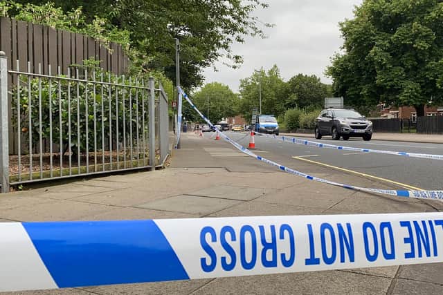 Police tape pictured along Lake Road.