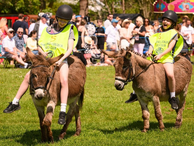 Two young riders having a great time at the Hayling Island Donkey Derby.Picture: Keith Woodland (250521-41)