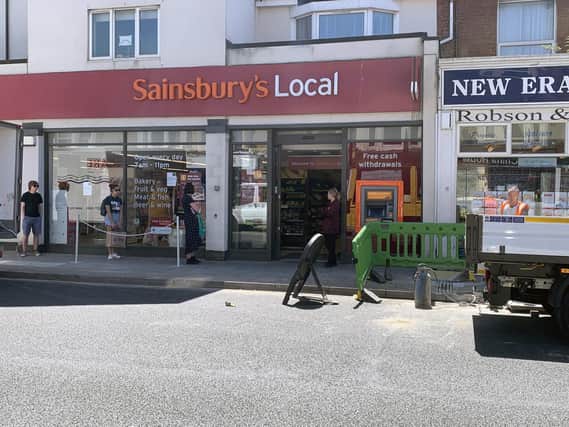 Roadworks to install fast internet in Portsmouth. People queuing outside Sainsbury's in Albert Road. Picture: Ben Fishwick.
