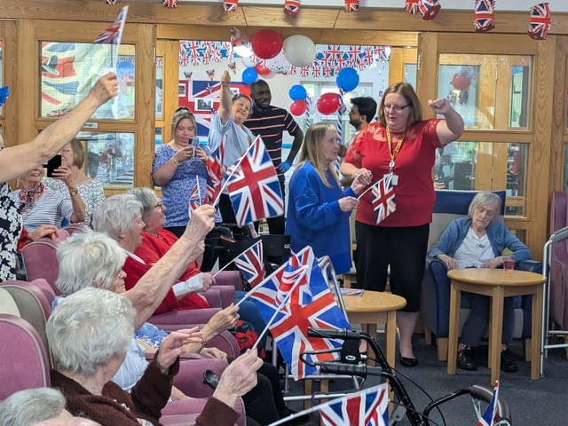 RCC residents wave their flags