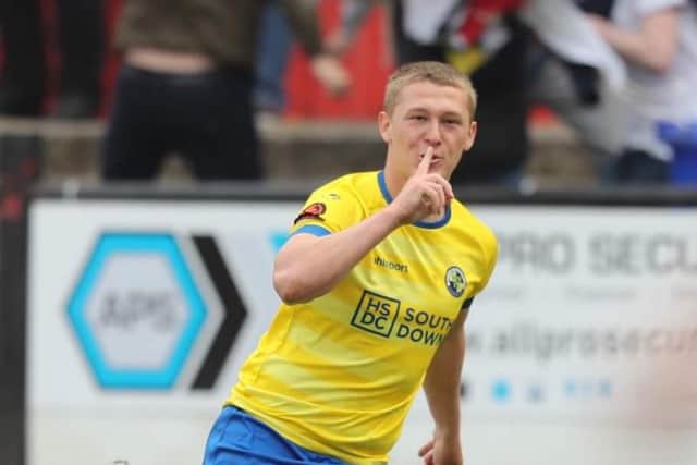 Jake Andrews puts his finger to his mouth after netting Hawks' last-gasp leveller at Welling United Picture: Dave Haines