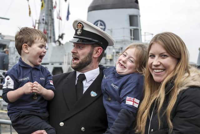 A sailors is greeted by his family as he returns to Portsmouth on HMS Cattistock after 10 weeks away on a NATO deployment.