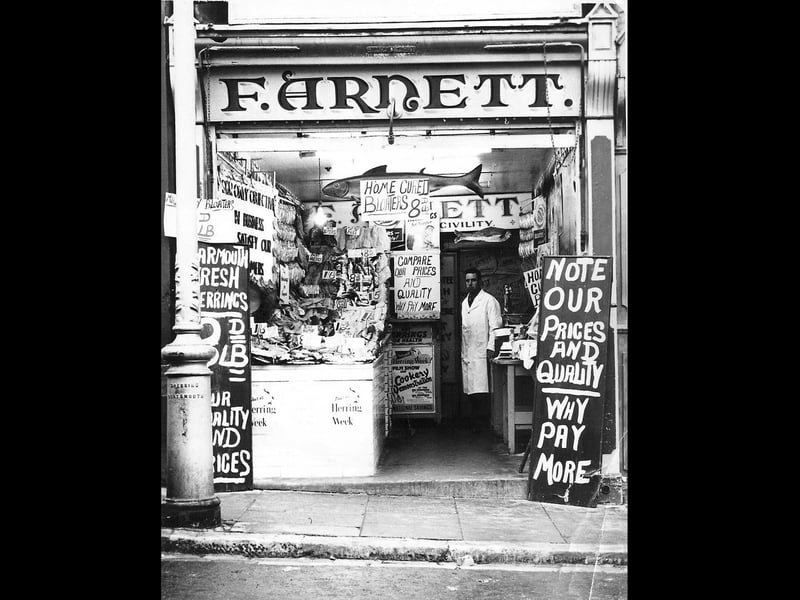 Dennis Bevan in the front of F Arnett's fish shop, High Street, Cosham.   .