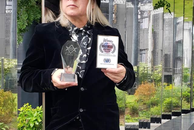 Gavin Irvine with awards that he has recently won