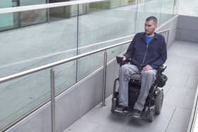 A powered wheelchair user.