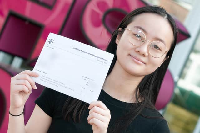 Portsmouth's Katherine Lai, 18, is off to the University of Oxford after bagging three A*s in her A-levels. Here she is pictured at Havant and South Downs College collecting her results.
Picture: Duncan Shepherd