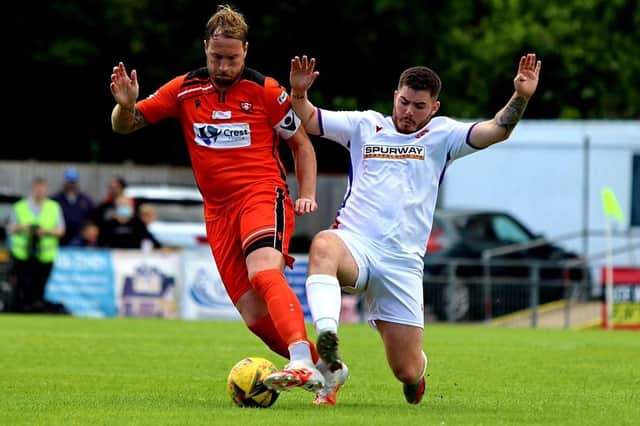 Portchester's Sam Pearce, left, in action against Gosport Borough in last weekend's Ray Stainton/Steve Woods Memorial Cup tie at Privett Park. Picture: Tom Phillips.