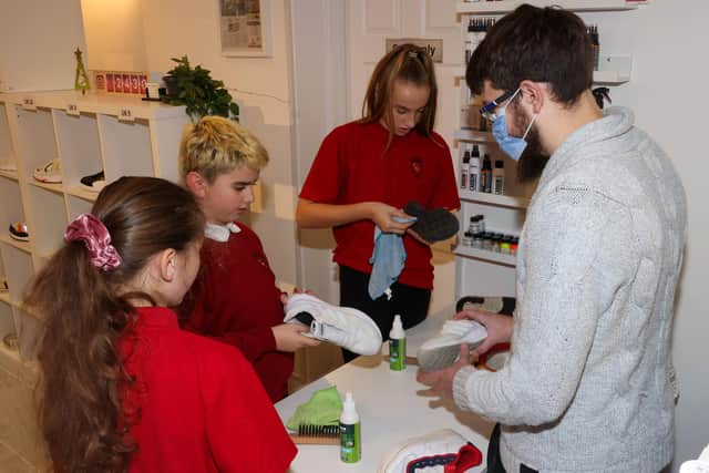 The pupils learn upcycling skills. Picture: Alex Shute