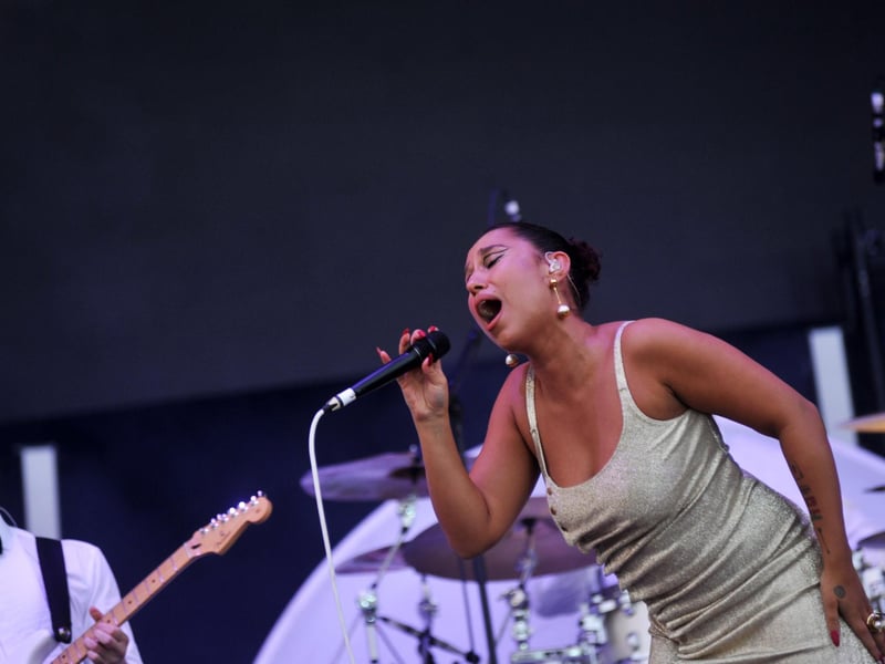 Raye performing on the Common Stage on Friday, August 25.