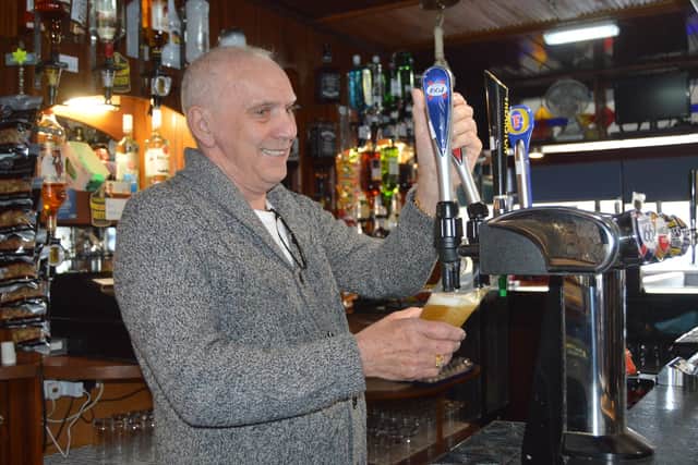 Tony Wingfield pouring a pint at the Raven Pub in Portsmouth. Picture: David George