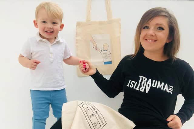 Chelsea Heaton-Penington and Pip Smith have created slogan tote bags to sell for PARCS. Pictured: Pip with her son Farrell, who inspired one of the designs