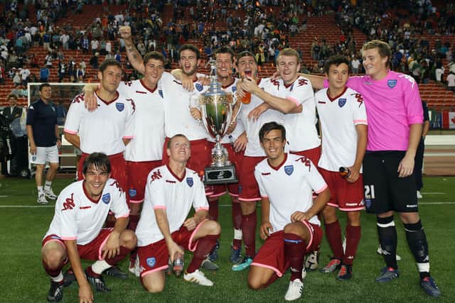 Michael Brown, David Nugent and Marc Wilson are joined by Pompey youngsters including Matt Ritchie, Joel Ward and Marlon Pack after winning the Edmonton Cup - part of their farcical pre-season tour of North America in 2010. Picture: Joe Pepler