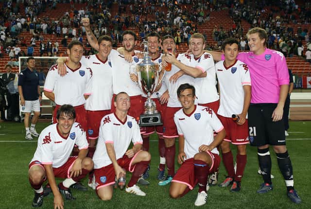 Michael Brown, David Nugent and Marc Wilson are joined by Pompey youngsters including Matt Ritchie, Joel Ward and Marlon Pack after winning the Edmonton Cup - part of their farcical pre-season tour of North America in 2010. Picture: Joe Pepler