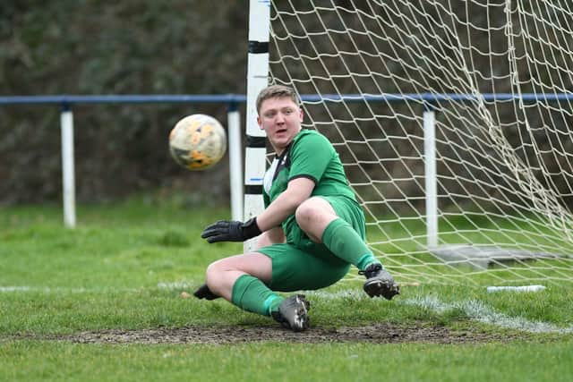 Paulsgrove keeper Taylor Revy watches Danny Lucas' penalty give Denmead the lead.

Picture: Neil Marshall