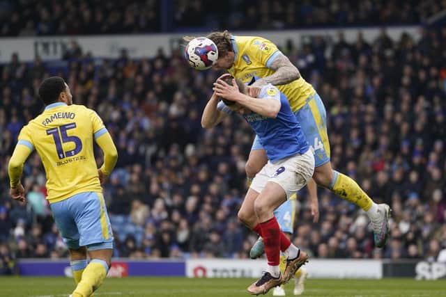 Colby Bishop gets some rough treatment at the hands of Sheffield Wednesday defender Aden Flint.