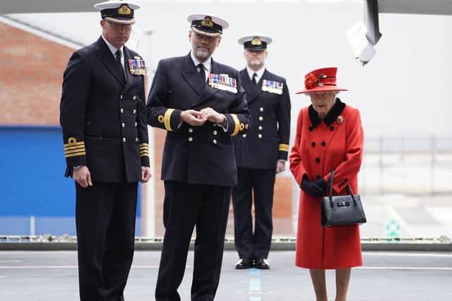 Queen Elizabeth II meeting personnel during a visit to HMS Queen Elizabeth at HM Naval Base, Portsmouth, ahead of the ship's maiden deployment. The visit comes as HMS Queen Elizabeth prepares to lead the UK Carrier Strike Group on a 28-week operational deployment travelling over 26,000 nautical miles from the Mediterranean to the Philippine Sea. Picture: Steve Parsons/PA Wire