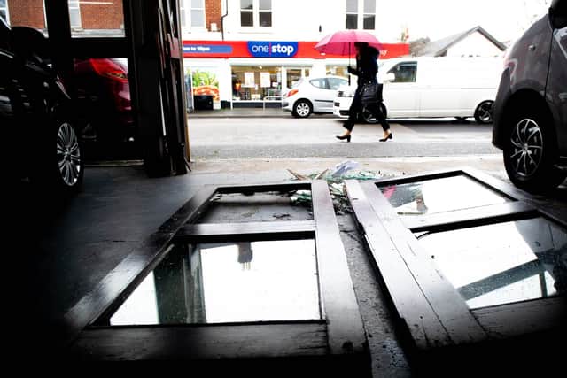 Wood and glass was strewn over the shop floor and the street in Copnor Road following the burglary. Pictured: Damages to the shop at GT Hewett & Son, Copnor, Portsmouth, on March 2, 2022. Picture: Habibur Rahman.