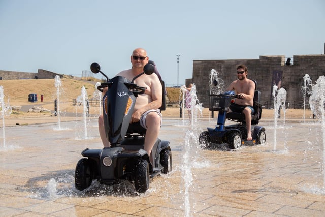 John Millington and Shane Davis at the fountain near Southsea Castle, Portsmouth in July last year - a perfect place to cool down and have some fun 
Picture: Habibur Rahman